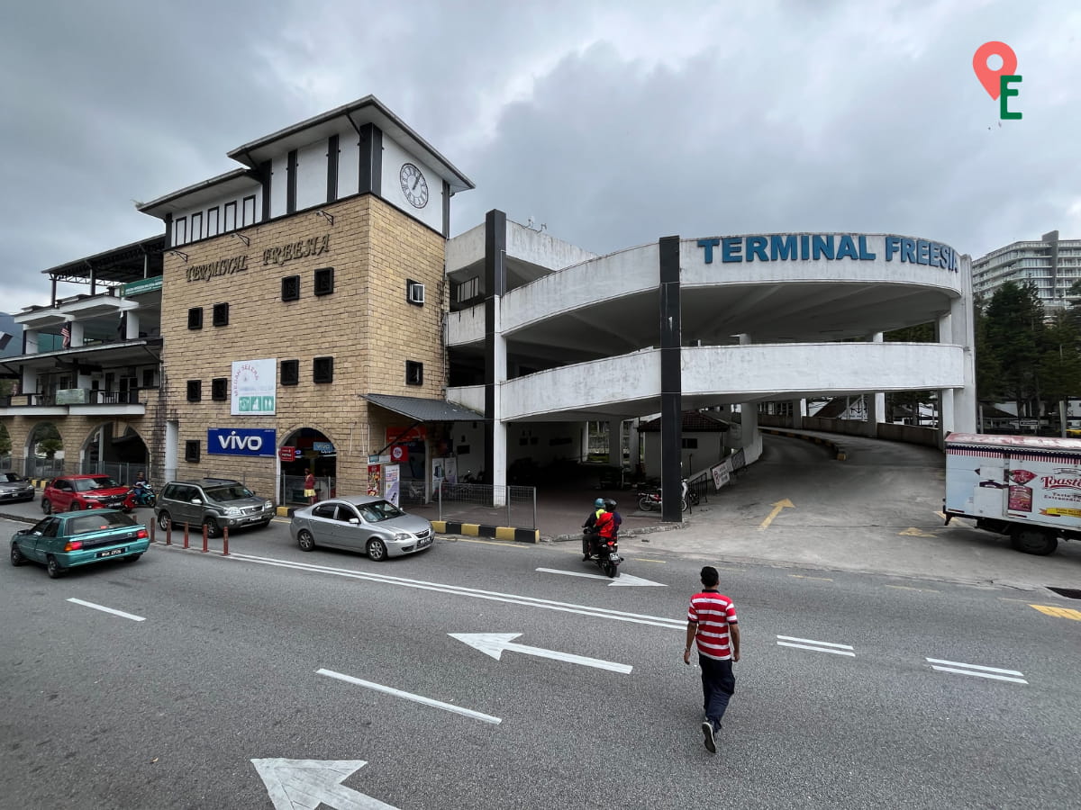 Pedestrian Crossing The Main Road To Reach The Bus Station In Tanah Rata